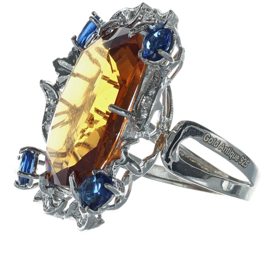 Anello in argento 925 con topazio e zaffiri.