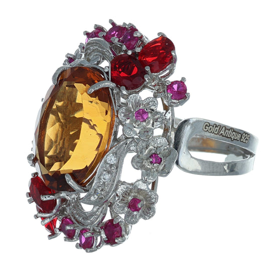 Anello argento 925 con rubini e topazio.