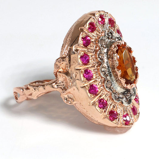 Anello Riproduzione antico con topazio e rubini.