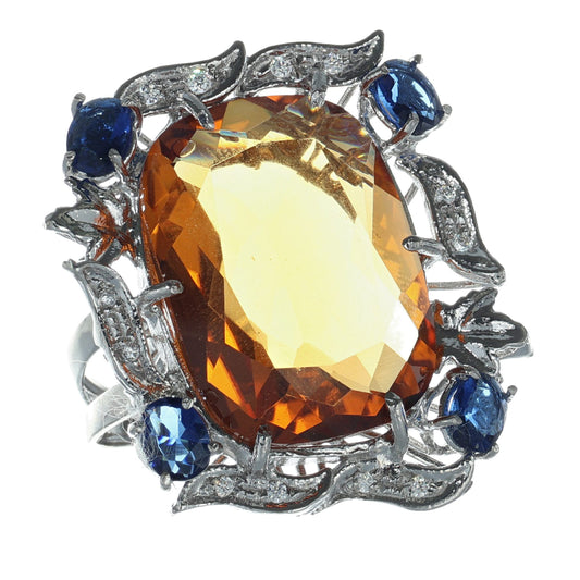 Anello in argento 925 con topazio e zaffiri.
