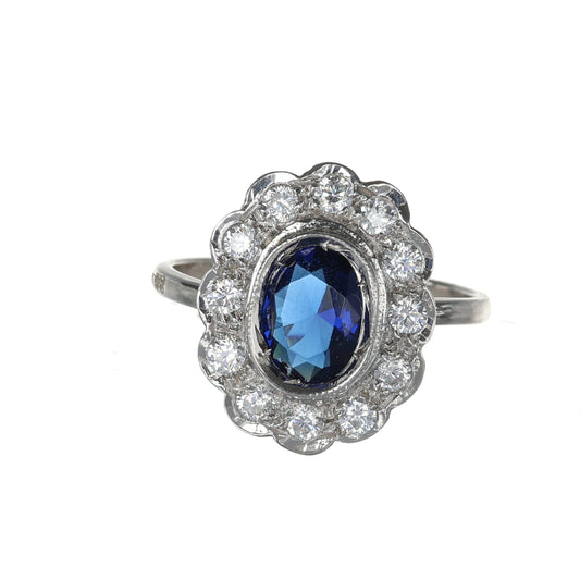 Anello con zaffiro e zirconi in argento 925.