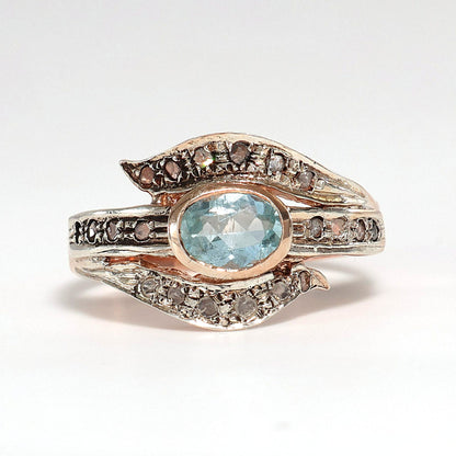 Anello Riproduzione antico con diamanti e topazio azzurro.