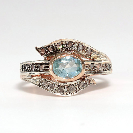 Anello Riproduzione antico con diamanti e topazio azzurro.