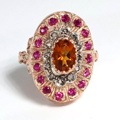 Anello Riproduzione antico con topazio e rubini.