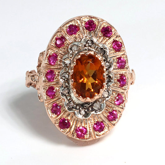 Anello Riproduzione antico con topazio e rubini.