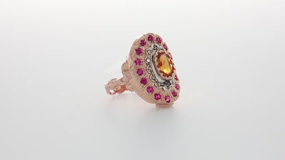 Anello Riproduzione antico con topazio e rubini.